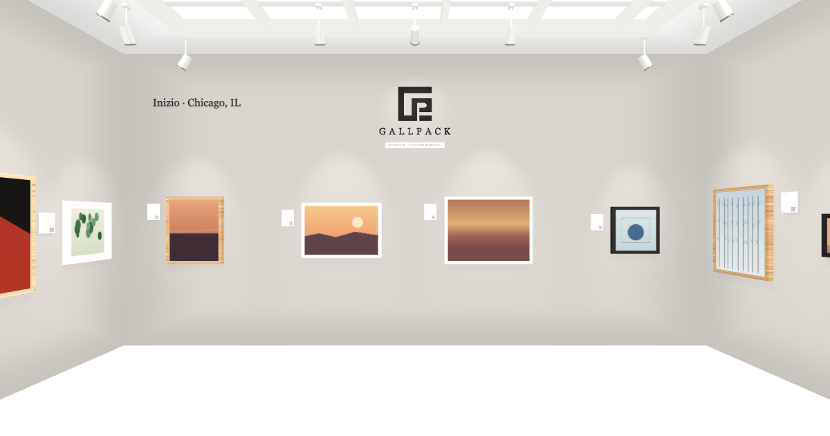 A gallery room with works hung at true size under track lights